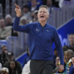 Golden State Warriors head coach Steve Kerr gestures toward players during the first half of an NBA basketball game against the Orlando Magic in San Francisco, Saturday, Jan. 7, 2023. (AP Photo/Jeff Chiu)