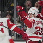 Detroit Red Wings left wing Lucas Raymond, right, celebrates after scoring against the Vegas Golden Knights during the first period of an NHL hockey game Thursday, Jan. 19, 2023, in Las Vegas. (AP Photo/John Locher)