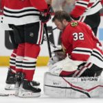 Chicago Blackhawks goaltender Alex Stalock (32) reacts after losing his helmet during a play during the third period of an NHL hockey game against the Arizona Coyotes, Friday, Jan. 6, 2023, in Chicago. (AP Photo/Erin Hooley)