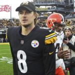 Pittsburgh Steelers quarterback Kenny Pickett (8) and Cleveland Browns quarterback Deshaun Watson walk off the field after shaking hands at the end of an NFL football game in Pittsburgh, Sunday, Jan. 8, 2023. The Steelers won 28-14. (AP Photo/Matt Freed)