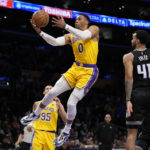 Los Angeles Lakers guard Russell Westbrook (0) shoots during the first half of an NBA basketball game against the Sacramento Kings in Los Angeles, Wednesday, Jan. 18, 2023. (AP Photo/Ashley Landis)
