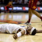 
              Oklahoma State's Avery Anderson III (0) lays on the floor during the first half of the NCAA college basketball game against Iowa State in Stillwater, Okla., Saturday, Jan. 21, 2023. (AP Photo/Mitch Alcala)
            