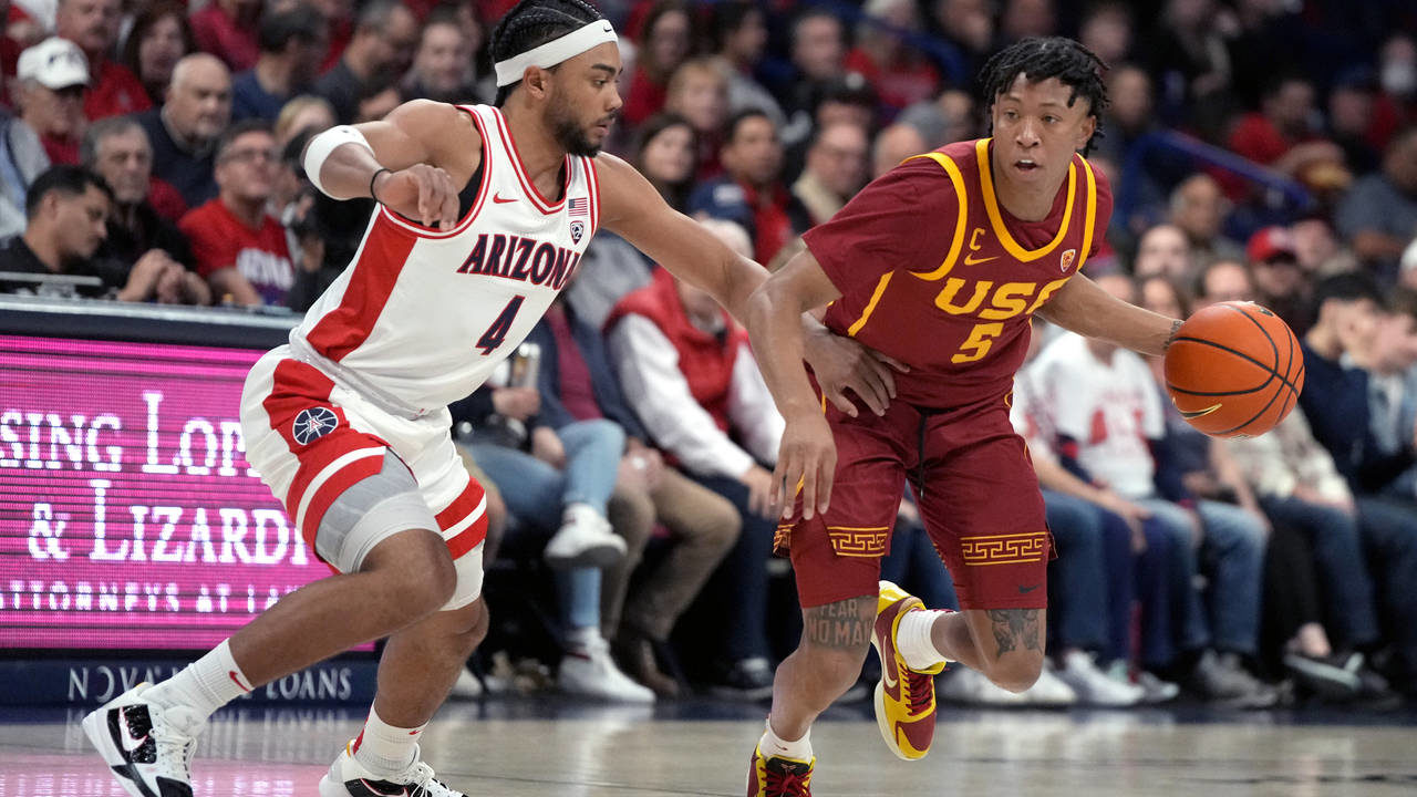 Southern California guard Boogie Ellis (5) drives on Arizona guard Kylan Boswell during the first h...