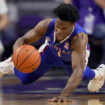 
              Kansas guard Joseph Yesufu chases after a loose ball during the first half of an NCAA college basketball game against Kansas State Tuesday, Jan. 17, 2023, in Manhattan, Kan. (AP Photo/Charlie Riedel)
            
