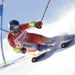 Switzerland's Marco Odermatt speeds down the course during an alpine ski, men's World Cup giant slalom race, in Adelboden, Switzerland, Saturday, Jan. 7, 2023. (AP Photo/Giovanni Pizzato)