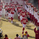 Kansas City Chiefs quarterback Patrick Mahomes (15) is introduced with his team before the start of an NFL football game against the Denver Broncos Sunday, Jan. 1, 2023, in Kansas City, Mo. (AP Photo/Charlie Riedel)