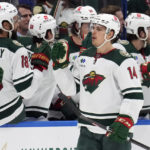Minnesota Wild center Joel Eriksson Ek (14) celebrates with the bench after his goal against the Tampa Bay Lightning during the second period of an NHL hockey game Tuesday, Jan. 24, 2023, in Tampa, Fla. (AP Photo/Chris O'Meara)
