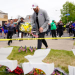 
              FILE - Buffalo Bills' Josh Allen visits the scene of Saturday's shooting at a supermarket, in Buffalo, N.Y., Wednesday, May 18, 2022. The Buffalo Bills have been a reliable bright spot for a city that has been shaken by a racist mass shooting and back-to-back snowstorms in recent months. So when Bills safety Damar Hamlin was critically hurt in a game Monday, the city quickly looked for ways to support the team. (AP Photo/Matt Rourke, File)
            