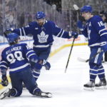 
              Toronto Maple Leafs forward William Nylander (88) celebrates his overtime goal with defenseman Timothy Liljegren (37) and forward Mitchell Marner (16) against the Florida Panthers during an NHL hockey game Tuesday, Jan. 17, 2023, in Toronto. (Nathan Denette/The Canadian Press via AP)
            