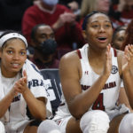 South Carolina guard Zia Cooke, left, and forward Aliyah Boston applaud their team during the second half of an NCAA college basketball game against Arkansas in Columbia, S.C., Sunday, Jan. 22, 2023. (AP Photo/Nell Redmond)