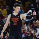 Southern California guard Drew Peterson, who scored, acknowledges a pass from a teammate, during the second half of the team's NCAA college basketball game against Arizona State in Tempe, Ariz., Saturday, Jan. 21, 2023. (AP Photo/Ross D. Franklin)