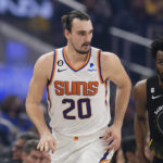 
              Phoenix Suns forward Dario Saric, left, celebrates after scoring a 3-point basket against the Golden State Warriors during the first half of an NBA basketball game in San Francisco, Tuesday, Jan. 10, 2023. (AP Photo/Godofredo A. Vásquez)
            