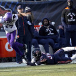 
              Minnesota Vikings wide receiver K.J. Osborn (17) is tackled by Chicago Bears safety Elijah Hicks (37) after catching a pass during the first half of an NFL football game, Sunday, Jan. 8, 2023, in Chicago. (AP Photo/Charles Rex Arbogast)
            