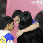 
              Cristiano Ronaldo hugs Georgina Rodriguez as they attend the official unveiling as a new member of Al Nassr soccer club in in Riyadh, Saudi Arabia, Tuesday, Jan. 3, 2023. Ronaldo, who has won five Ballon d'Ors awards for the best soccer player in the world and five Champions League titles, will play outside of Europe for the first time in his storied career. (AP Photo/Amr Nabil)
            