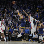 Golden State Warriors guard Klay Thompson makes a 3-point basket from between Detroit Pistons forward Saddiq Bey (41), center Isaiah Stewart, left rear, and guard Killian Hayes (7) during the second half of an NBA basketball game in San Francisco, Wednesday, Jan. 4, 2023. (AP Photo/Jeff Chiu)