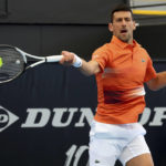 
              Serbia's Novak Djokovic makes a forehand return to France's Constant Lestienne during their Round of 32 match at the Adelaide International Tennis tournament in Adelaide, Australia, Tuesday, Jan. 3, 2023. (AP Photo/Kelly Barnes)
            