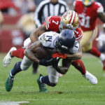 Seattle Seahawks wide receiver DK Metcalf (14) is tackled by San Francisco 49ers cornerback Charvarius Ward (7) during the second half of an NFL wild card playoff football game in Santa Clara, Calif., Saturday, Jan. 14, 2023. (AP Photo/Jed Jacobsohn)
