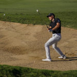 
              Jordan Spieth plays a shot from a bunker on the 14th hole during the first round of the Tournament of Champions golf event, Thursday, Jan. 5, 2023, at Kapalua Plantation Course in Kapalua, Hawaii. (AP Photo/Matt York)
            