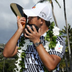 
              Si Woo Kim kisses the champions trophy after the final round of the Sony Open golf tournament, Sunday, Jan. 15, 2023, at Waialae Country Club in Honolulu. (AP Photo/Matt York)
            