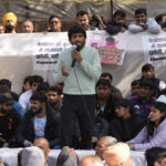 
              Bajrang Punia, Indian wrestler who won a Bronze medal at the 2020 Tokyo Olympics, addresses the media during a protest against Wrestling Federation of India President Brijbhushan Sharan Singh and other officials in New Delhi, India, Friday, Jan. 20, 2023. Top India wrestlers led a protest near the parliament building accusing the federation president and coaches of sexually and mentally harassing young wrestlers. (AP Photo/Manish Swarup)
            
