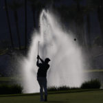 
              Davis Thompson hits from the fairway to the 18th green during the American Express golf tournament on the La Quinta Country Club Course Thursday, Jan. 19, 2023, in La Quinta, Calif. (AP Photo/Mark J. Terrill)
            