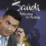
              Cristiano Ronaldo speaks during a press conference for his official unveiling as a new member of Al Nassr soccer club in in Riyadh, Saudi Arabia, Tuesday, Jan. 3, 2023. Ronaldo, who has won five Ballon d'Ors awards for the best soccer player in the world and five Champions League titles, will play outside of Europe for the first time in his storied career. (AP Photo/Amr Nabil)
            