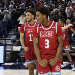 
              Loyola Marymount guards Chance Stephens, right, and Kwane Marble celebrate the team's 68-67 win against Gonzaga after an NCAA college basketball game, Thursday, Jan. 19, 2023, in Spokane, Wash. (AP Photo/Young Kwak)
            
