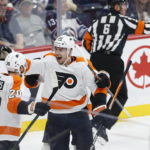 
              Philadelphia Flyers' Kieffer Bellows (20) and Rasmus Ristolainen (55) celebrate Bellows' goal against the Winnipeg Jets during the second period of an NHL hockey game, Saturday, Jan. 28, 2023 in Winnipeg, Manitoba. (John Woods/The Canadian Press via AP)
            