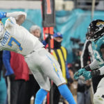 Los Angeles Chargers tight end Gerald Everett (7) makes the catch against the Jacksonville Jaguars during the second half of an NFL wild-card football game, Saturday, Jan. 14, 2023, in Jacksonville, Fla. (AP Photo/Chris Carlson)