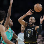 Golden State Warriors forward Andre Iguodala (9) moves the ball past San Antonio Spurs guard Josh Richardson (7) during the second half of an NBA basketball game in San Antonio, Friday, Jan. 13, 2023. (AP Photo/Eric Gay)