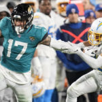 Los Angeles Chargers cornerback Bryce Callahan (23) hits Jacksonville Jaguars tight end Evan Engram (17) during the second half of an NFL wild-card football game, Saturday, Jan. 14, 2023, in Jacksonville, Fla. (AP Photo/John Raoux)