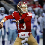 San Francisco 49ers quarterback Brock Purdy (13) passes against the Dallas Cowboys during the first half of an NFL divisional round playoff football game in Santa Clara, Calif., Sunday, Jan. 22, 2023. (AP Photo/Josie Lepe)