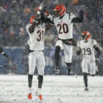 
              Cincinnati Bengals safety Michael Thomas (31) and Cincinnati Bengals cornerback Eli Apple (20) react after a defensive play against the Buffalo Bills during the fourth quarter of an NFL division round football game, Sunday, Jan. 22, 2023, in Orchard Park, N.Y. (AP Photo/Seth Wenig)
            