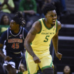 Oregon guard Jermaine Couisnard (5) reacts after making a shot against against Arizona during the second half of an NCAA college basketball game Saturday, Jan. 14, 2023, in Eugene, Ore. (AP Photo/Andy Nelson)
