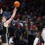 
              Purdue guard Braden Smith shoots as Ohio State guard Isaac Likekele watches during the second half of an NCAA college basketball game in Columbus, Ohio, Thursday, Jan. 5, 2023. (AP Photo/Paul Vernon)
            
