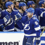 
              Tampa Bay Lightning center Steven Stamkos (91) celebrates with the bench after his goal against the Minnesota Wild during the third period of an NHL hockey game Tuesday, Jan. 24, 2023, in Tampa, Fla. (AP Photo/Chris O'Meara)
            