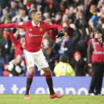 Manchester United's Raphael Varane celebrates at the end of the English Premier League soccer match between Manchester United and Manchester City at Old Trafford in Manchester, England, Saturday, Jan. 14, 2023. (AP Photo/Dave Thompson)