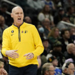 Indiana Pacers head coach Rick Carlisle yells from the sideline during the first half of an NBA basketball game against the Milwaukee Bucks, Monday, Jan. 16, 2023, in Milwaukee. (AP Photo/Aaron Gash)