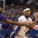 
              Kansas guard Dajuan Harris Jr. (3) passes under pressure from Kansas State forward Nae'Qwan Tomlin, left, during the first half of an NCAA college basketball game Tuesday, Jan. 31, 2023, in Lawrence, Kan. (AP Photo/Charlie Riedel)
            