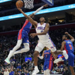 
              Philadelphia 76ers guard Tyrese Maxey (0) attempts a lay-up as Detroit Pistons forward Nerlens Noel (9) defends during the first half of an NBA basketball game, Sunday, Jan. 8, 2023, in Detroit. (AP Photo/Carlos Osorio)
            