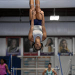 Fisk University gymnast HyCei White performs her floor exercise routine during a team practice at the Nashville Gymnastics Training Center on Wednesday, Dec. 28, 2022, in Nashville, Tenn. Fisk University will make history this week when the school's women's gymnastics team becomes the first Historically Black College and University to compete at the NCAA level. (AP Photo/Mark Zaleski)