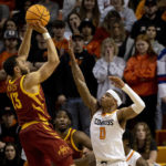 
              Iowa State's Jaren Holmes (13) shoots over Oklahoma State's Avery Anderson III (0) in the first half of the NCAA college basketball game in Stillwater, Okla., Saturday, Jan. 21, 2023. (AP Photo/Mitch Alcala)
            