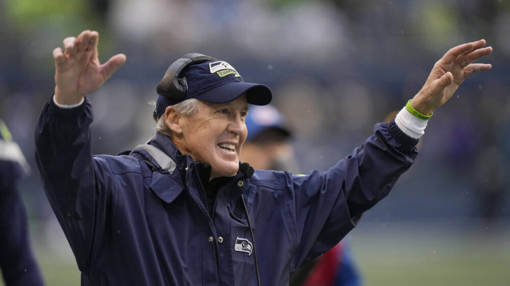 Seattle Seahawks head coach Pete Carroll celebrates after a touchdown catch by wide receiver Tyler ...