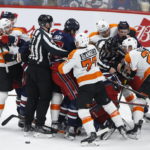 Winnipeg Jets and the Philadelphia Flyers players fight during the second period of an NHL hockey game, Saturday, Jan. 28, 2023 in Winnipeg, Manitoba. (John Woods/The Canadian Press via AP)