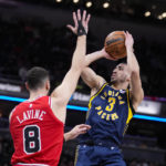 
              Indiana Pacers guard Chris Duarte (3) shoots over Chicago Bulls guard Zach LaVine (8) during the first half of an NBA basketball game in Indianapolis, Tuesday, Jan. 24, 2023. (AP Photo/Michael Conroy)
            