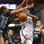 
              Georgetown's Brianna Scott, left, stops UConn's Aubrey Griffin (44) in the first half of an NCAA college basketball game, Sunday, Jan. 15, 2023, in Hartford, Conn. (AP Photo/Jessica Hill)
            