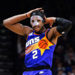 Phoenix Suns' Josh Okogie (2) hams it up after making a 3-pointer against the Indiana Pacers during the second half of an NBA basketball game in Phoenix, Saturday, Jan. 21, 2023. (AP Photo/Darryl Webb)