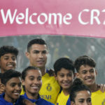 
              Cristiano Ronaldo poses with young players during his official unveiling as a new member of Al Nassr soccer club in in Riyadh, Saudi Arabia, Tuesday, Jan. 3, 2023. Ronaldo, who has won five Ballon d'Ors awards for the best soccer player in the world and five Champions League titles, will play outside of Europe for the first time in his storied career. (AP Photo/Amr Nabil)
            