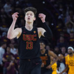 Southern California guard Drew Peterson celebrates his 3-point basket against Arizona State during the second half of an NCAA college basketball game in Tempe, Ariz., Saturday, Jan. 21, 2023. (AP Photo/Ross D. Franklin)