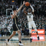 
              Michigan State guard Tyson Walker (2), defended by Purdue guard Ethan Morton attempts a last second shot during the second half of an NCAA college basketball game, Monday, Jan. 16, 2023, in East Lansing, Mich. (AP Photo/Carlos Osorio)
            